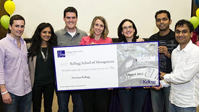 Members of the Class of 2012 present the class gift of $128,559 to Dean of Students Betsy Ziegler (center) and Kellogg Dean Sally Blount (third from right).