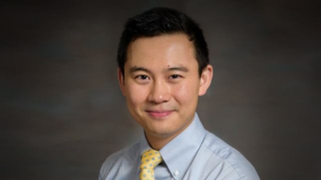 A headshot of alumnus Han Wei Wu