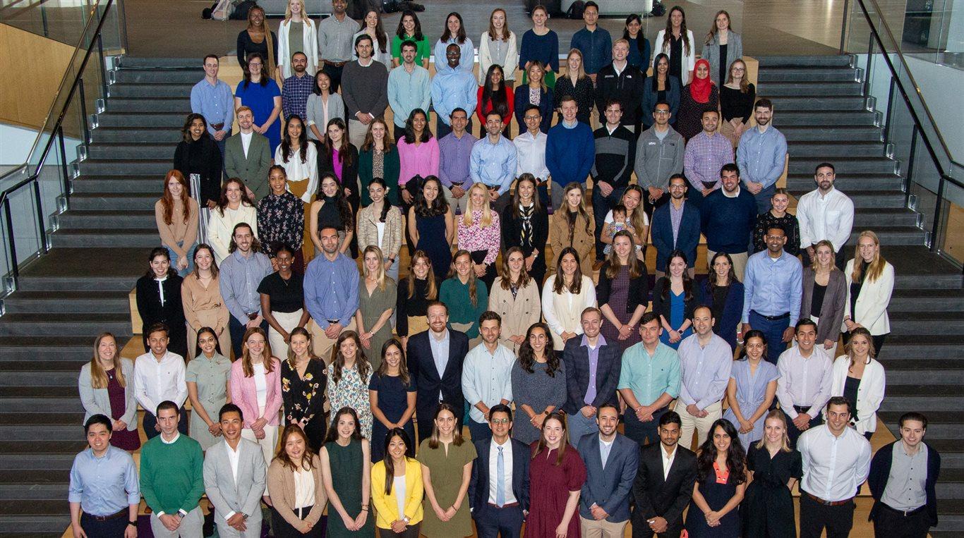 Group photo of around 100 Golub Capital Board Fellows standing on the Spanish steps in the Kellogg Global Hub