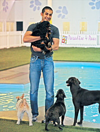 Saqib Nadeem '05 with some clients at Paradise 4 Paws