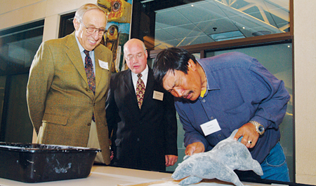 Master carver Nuna Parr with Dean Emeritus Donald P. Jacobs and Eliot Waldman