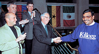 Kellogg Graduate Management Association President Brian Poger '01, left, was among those welcoming new dean, Dipak C. Jain, right in May 2001.