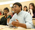 Students pose questions during the May 31 debate over whether social media will advance democracy in the Middle East