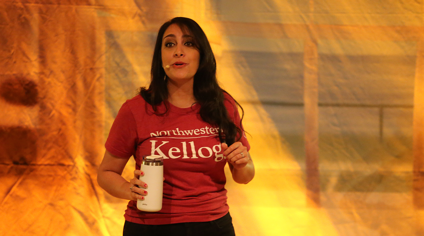 Full-time student Ava Quail speaking in front of a crowd during Special K!