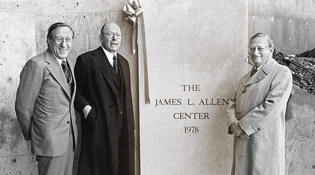 1979: Three men pose by the dedication stone for the James A. Allen Center