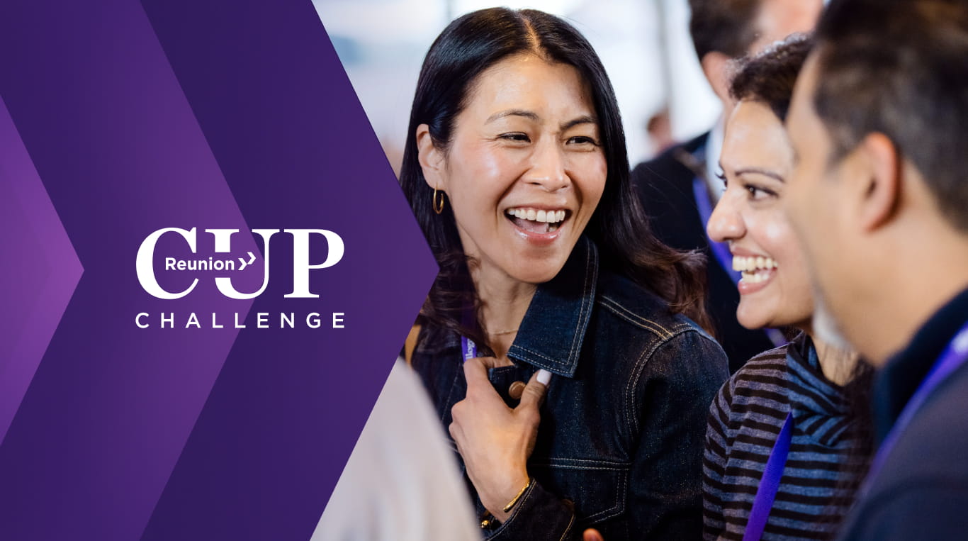 Three alumni smile with each other. The "Reunion Cup Challenge" logo is emblazoned in chirons on the left.