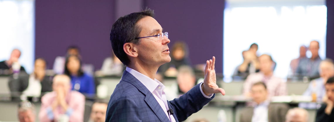 Professor Eric Anderson lectures at the front of a classroom
