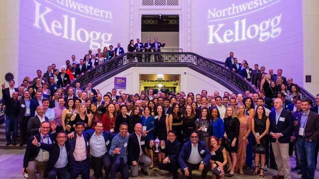 Large group of Kellogg graduates gathered for an alumni celebration