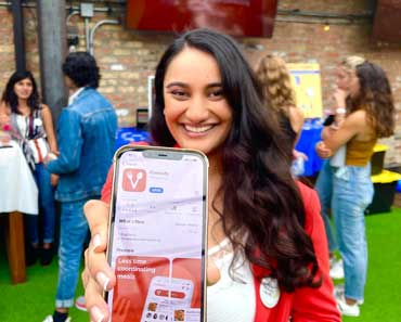 Alumna and startup founder Malvi Hemani shows off her app Cravosity