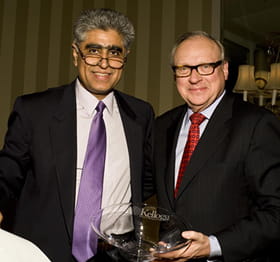 Interim Dean Sunil Chopra (left) with Alumni Service Award winner