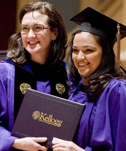 Kellogg Dean Sally Blount (left) with EMP-80 graduate Cristina Burrola