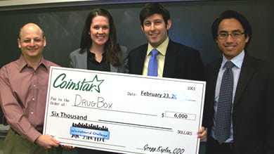 From left to right: Gregg Kaplan, president and COO of Coinstar, Inc. and DrugBox team members Sheila Schottland ’11, David Schottland ’11, and Raphael Tse ’11.  