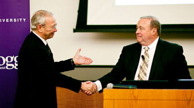 Bush Brothers CEO James B. Ethier (right) accepts the Kellogg Family Enterprise Leadership Award from John L. Ward, director of the Center for Family Enterprises.