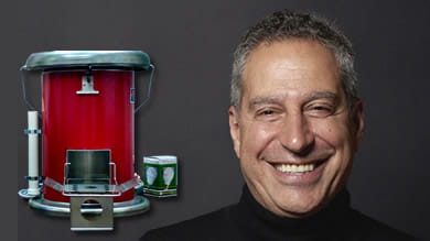 Selim Bassoul ’81, and the portable cookstove his company’s engineers designed for use in refugee camps.