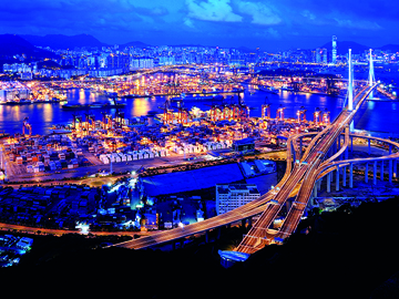 A modern bridge spans the view of an urban landscape.