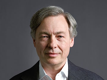 A portrait of Gregory Carpenter.