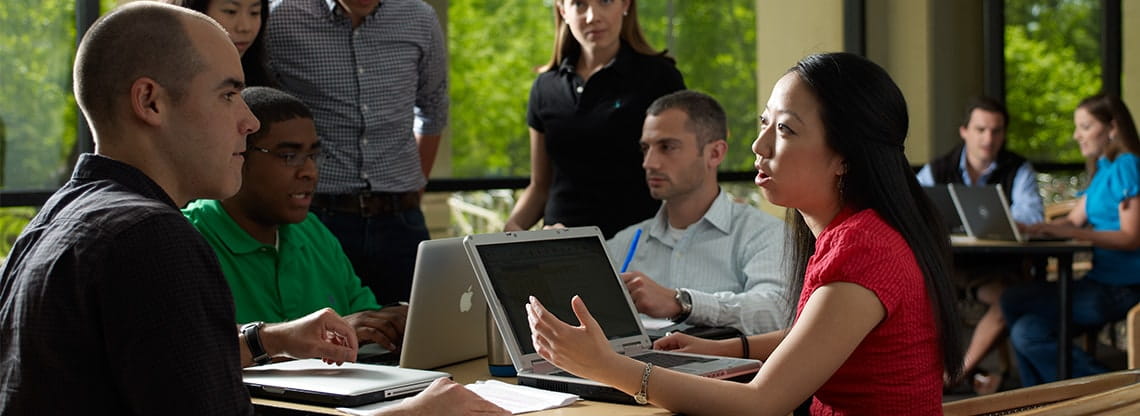 A group of students collaborate in the Jacobs center in Evanston.
