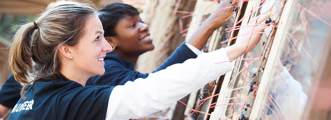Two women volunteer their time.