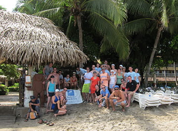 A group of KWEST members on a trip to a tropical climate.