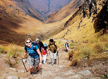 A group of KWEST members on a trip to a mountainous landscape.
