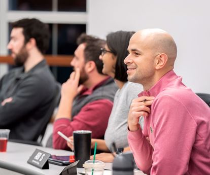 4 Kellogg students attending a lecture