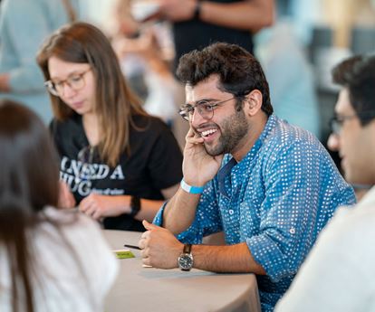 Four students sitting around a table
