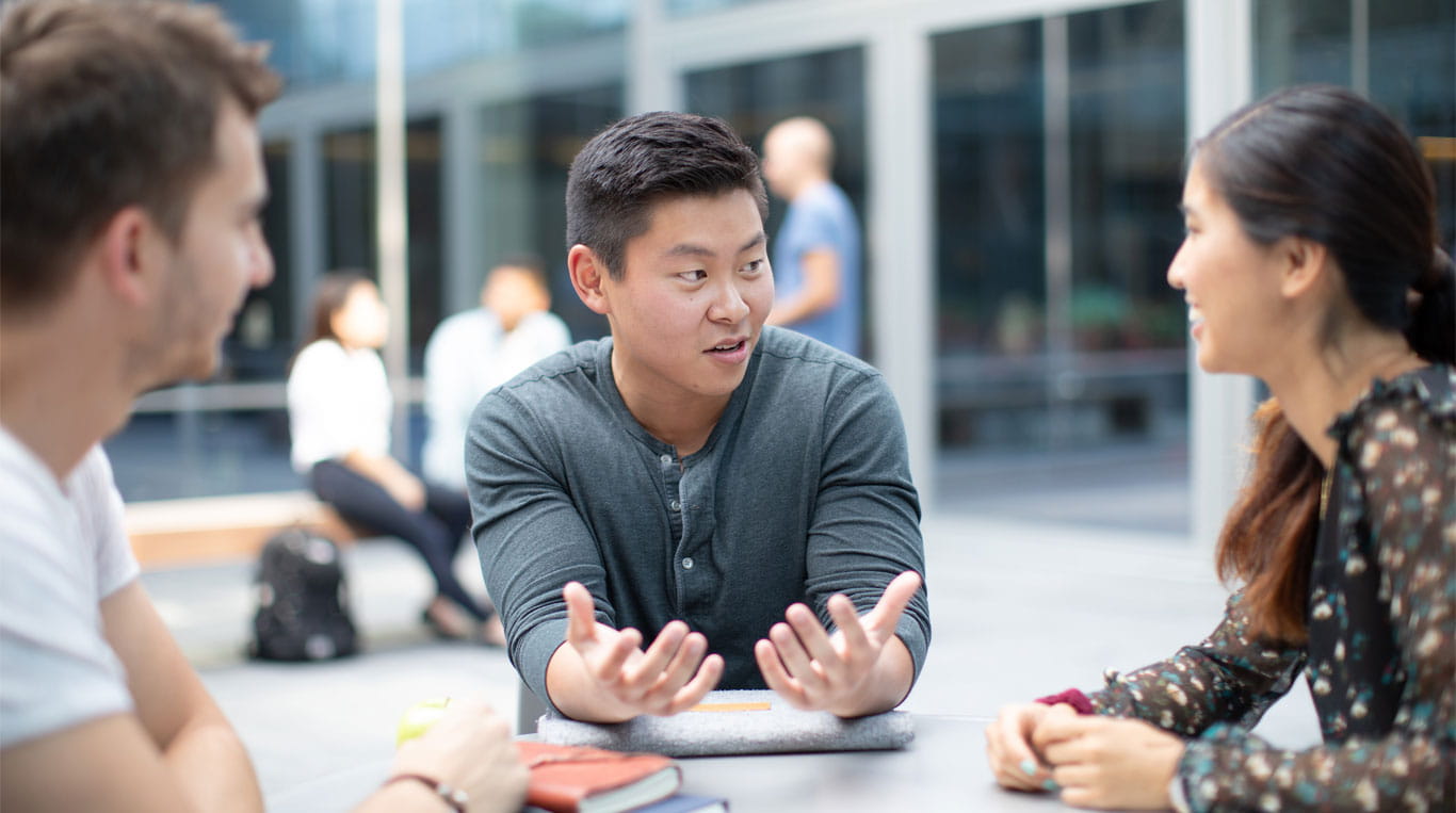 Kellogg students chatting outside the Global Hub on campus