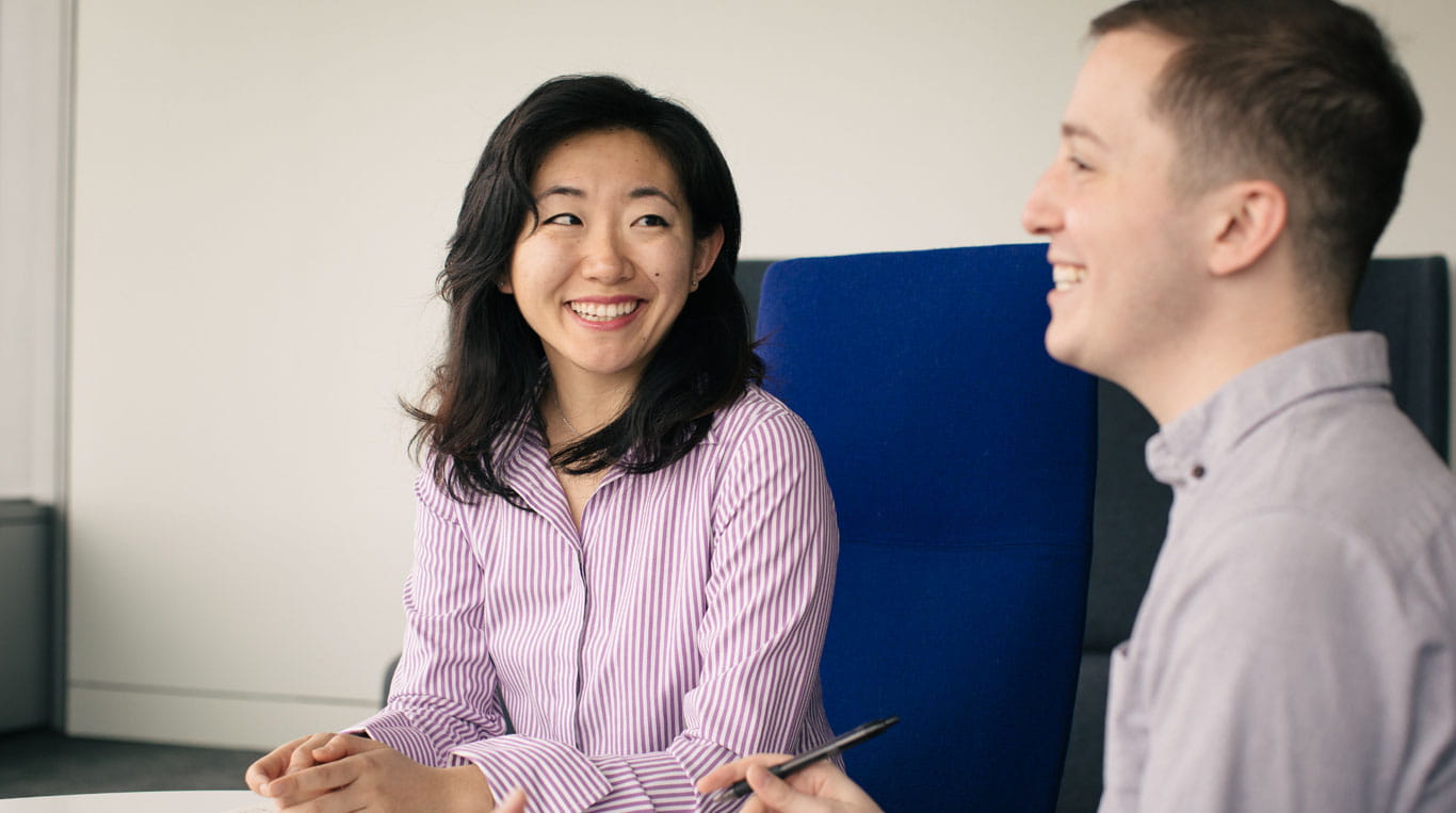 Two Kellogg doctoral students engaging in conversation.