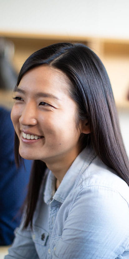 Headshot of one smiling Kellogg MBA student