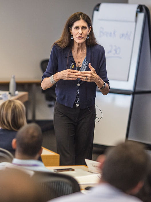 Kellogg professor Leigh Thompson teaching mid- to senior-level executives in an Executive MBA classroom