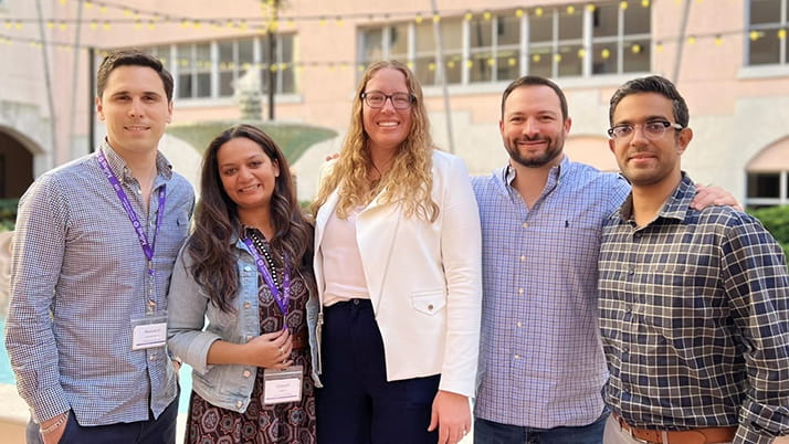 EMBA student Rebecca Smith standing with her classmates