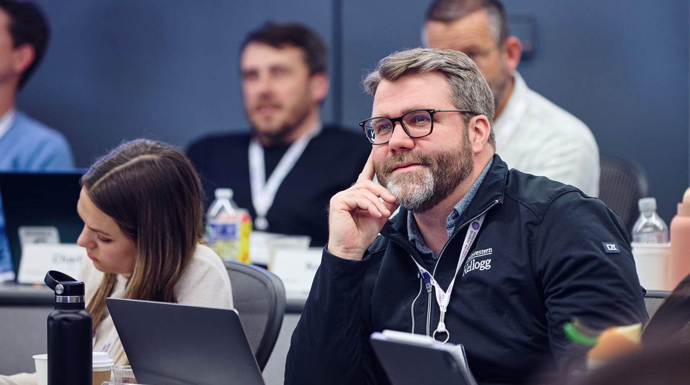 Patrick Ferguson listens thoughtfully to a Kellogg EMBA lecture