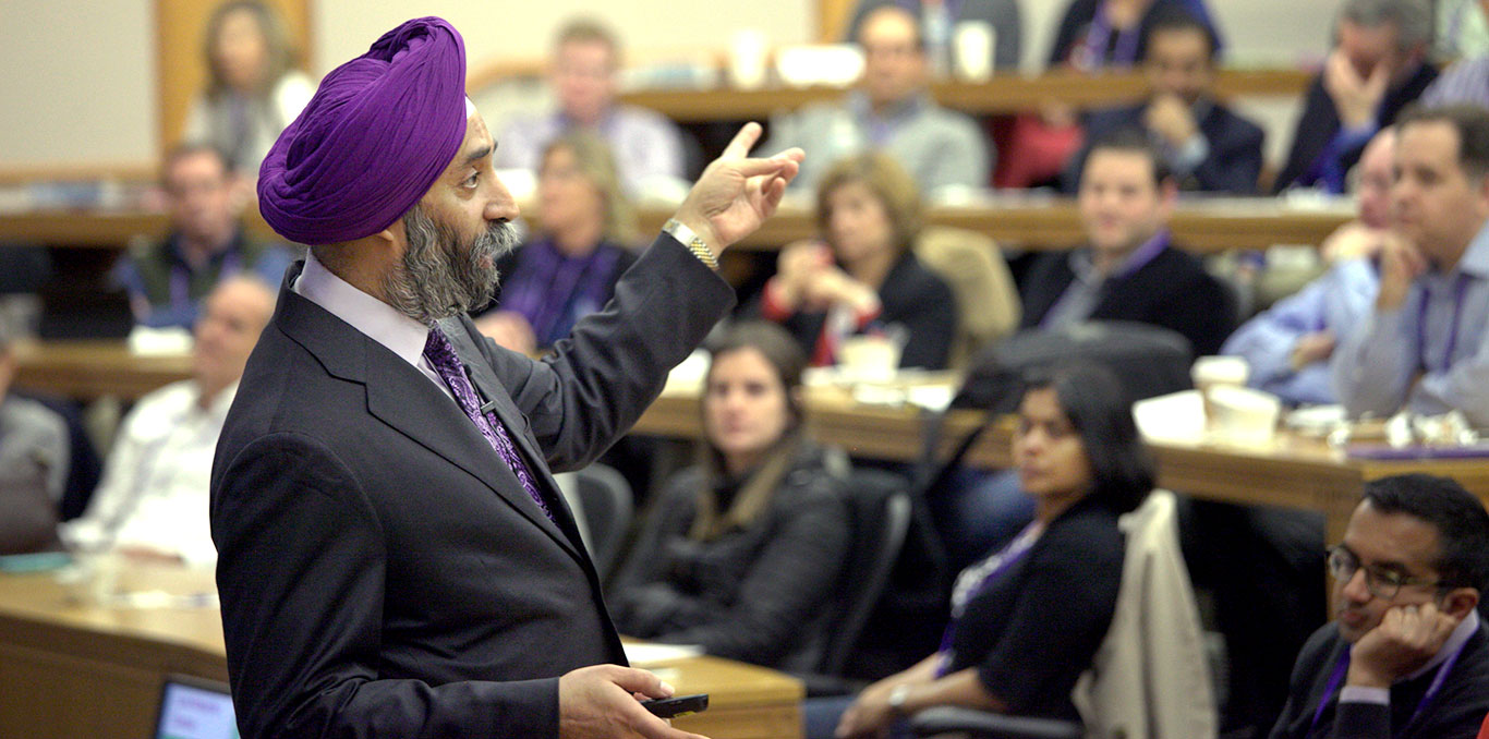 A male professor teaches in a lecture hall filled with students at Northwestern University