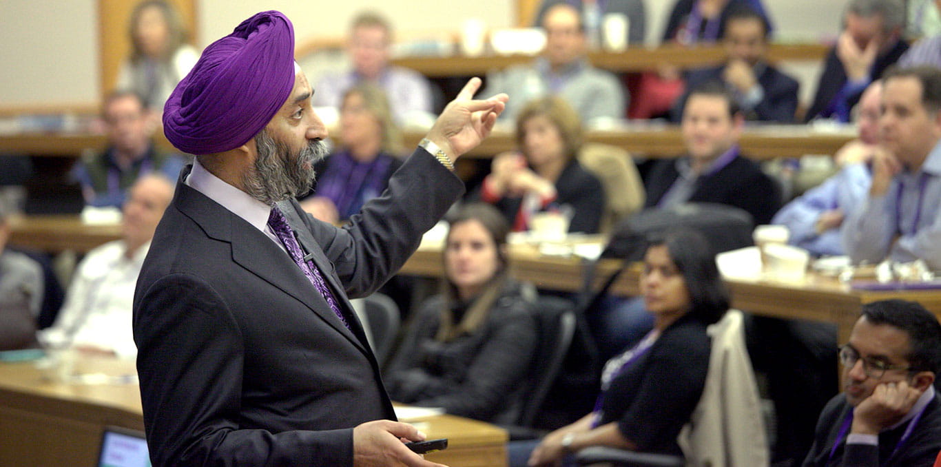 A male professor teaches in a lecture hall filled with students at Northwestern University