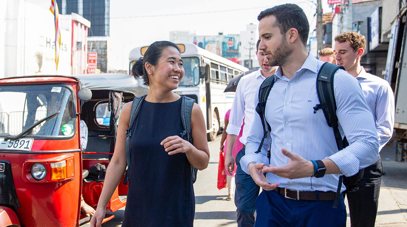 Kellogg students walking through a street in Jakarta