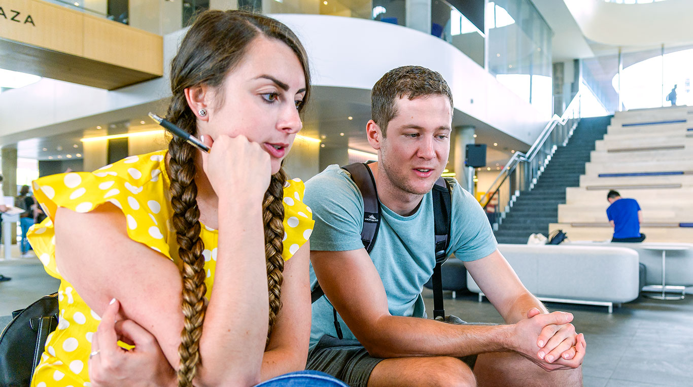 MBA students working together in the Global Hub Atrium