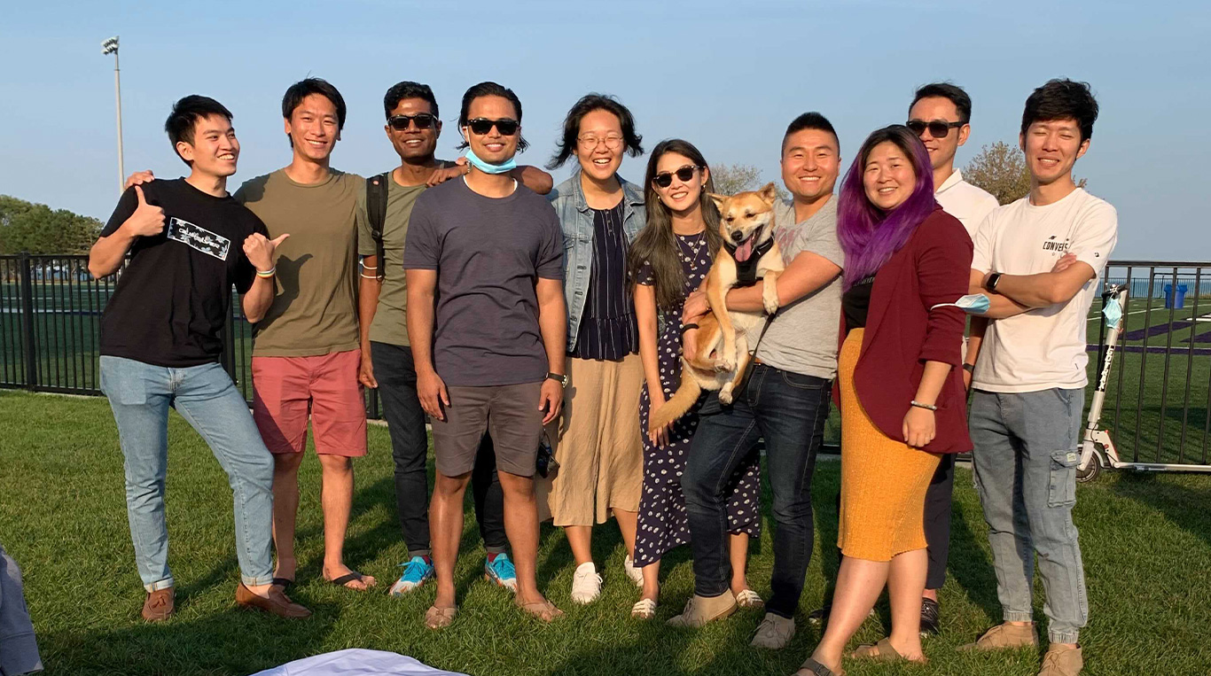 Members of Kellogg's Asian Management Association pose outside.