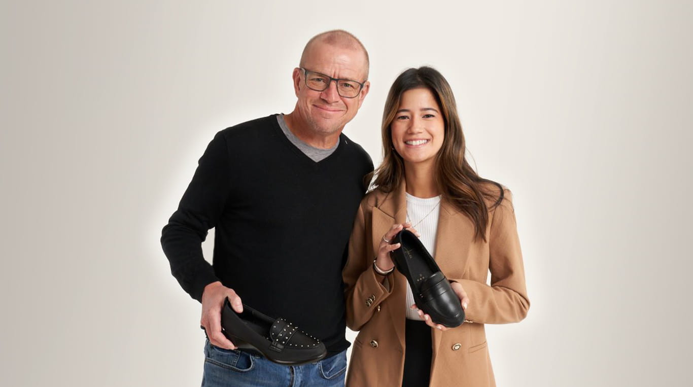 kellogg student jamie curran holds her product next to her father