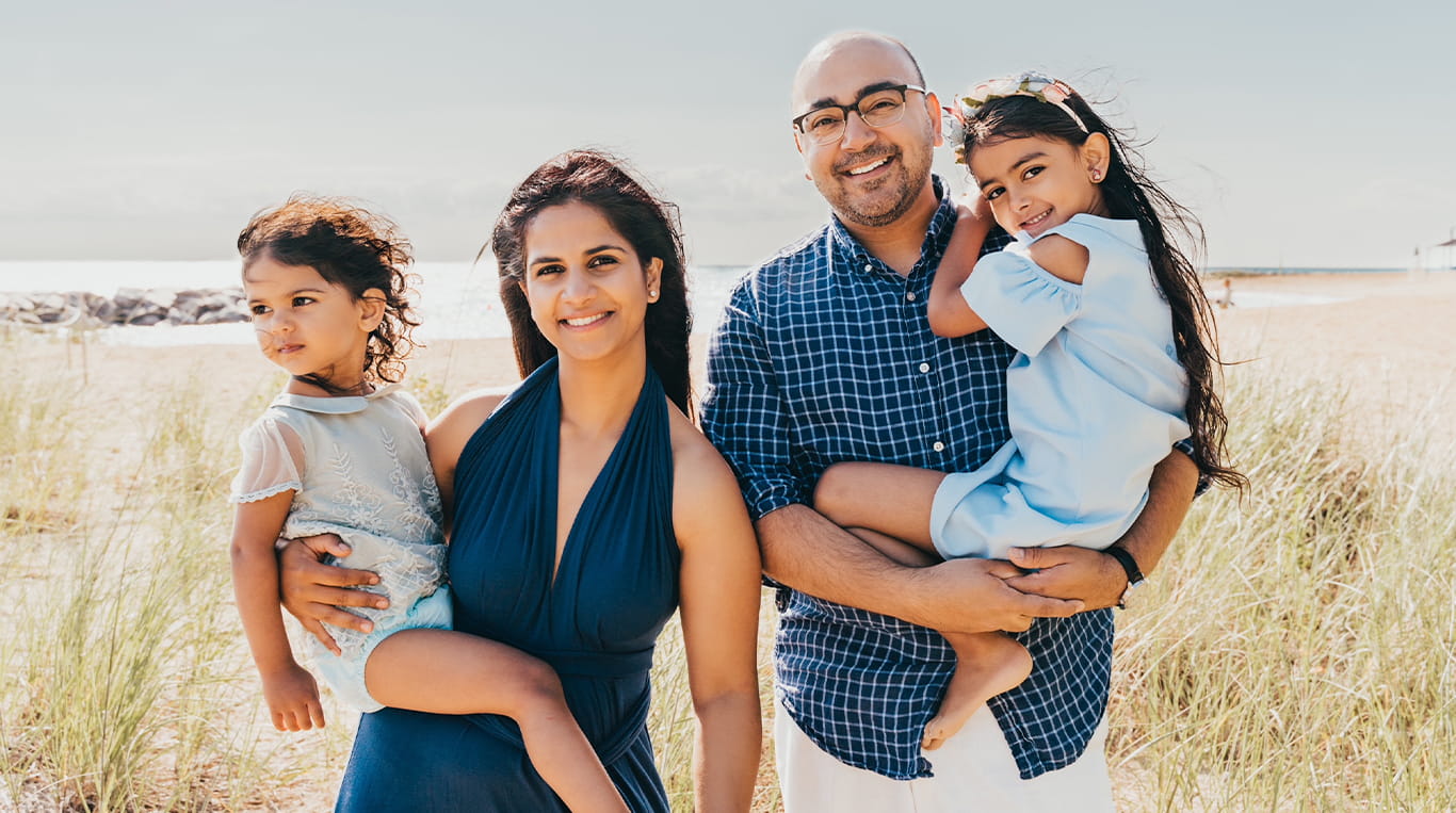 Kellogg graduate Ajit Kalra '20 with his wife, Sukhu, and their children