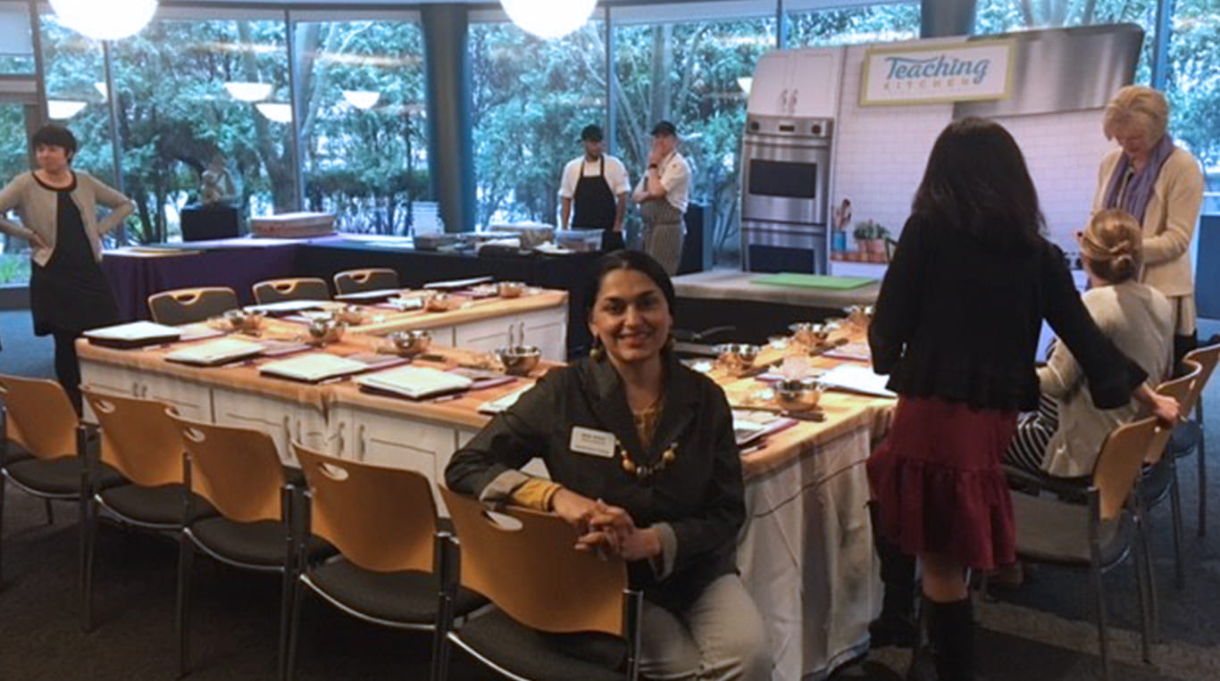 KHAI president Naini Serohi sits at a table as part of a "Teaching Kitchen" event at the Allen Center.