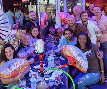 Evening & Weekend MBA student Bailey Mayer with classmates at drag show