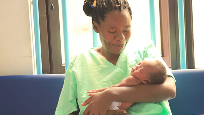 An African mother with her newborn baby, Nest 360 Program