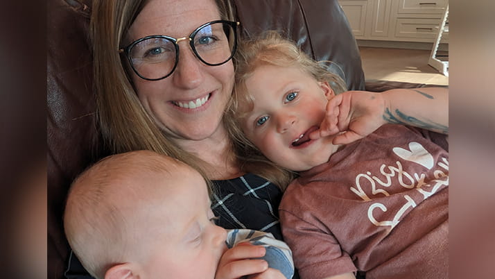 Andria Rae Bauman ’25, a part-time MBA candidate at Kellogg, with her two children