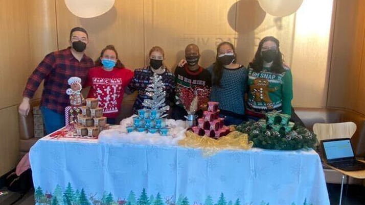 Eden alongside her team at the 26th Annual Kellogg Marketing Competition