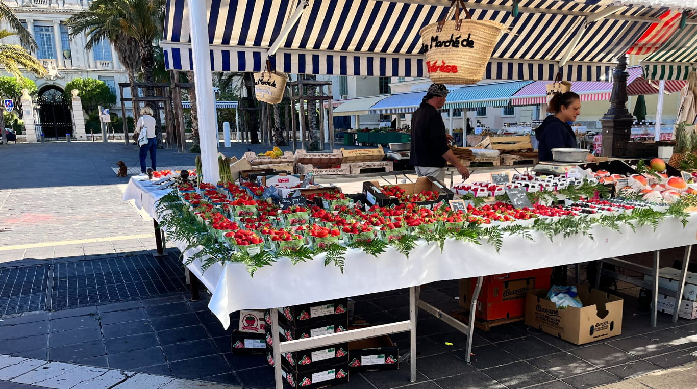 A vendor's booth at a farmer's market in France.
