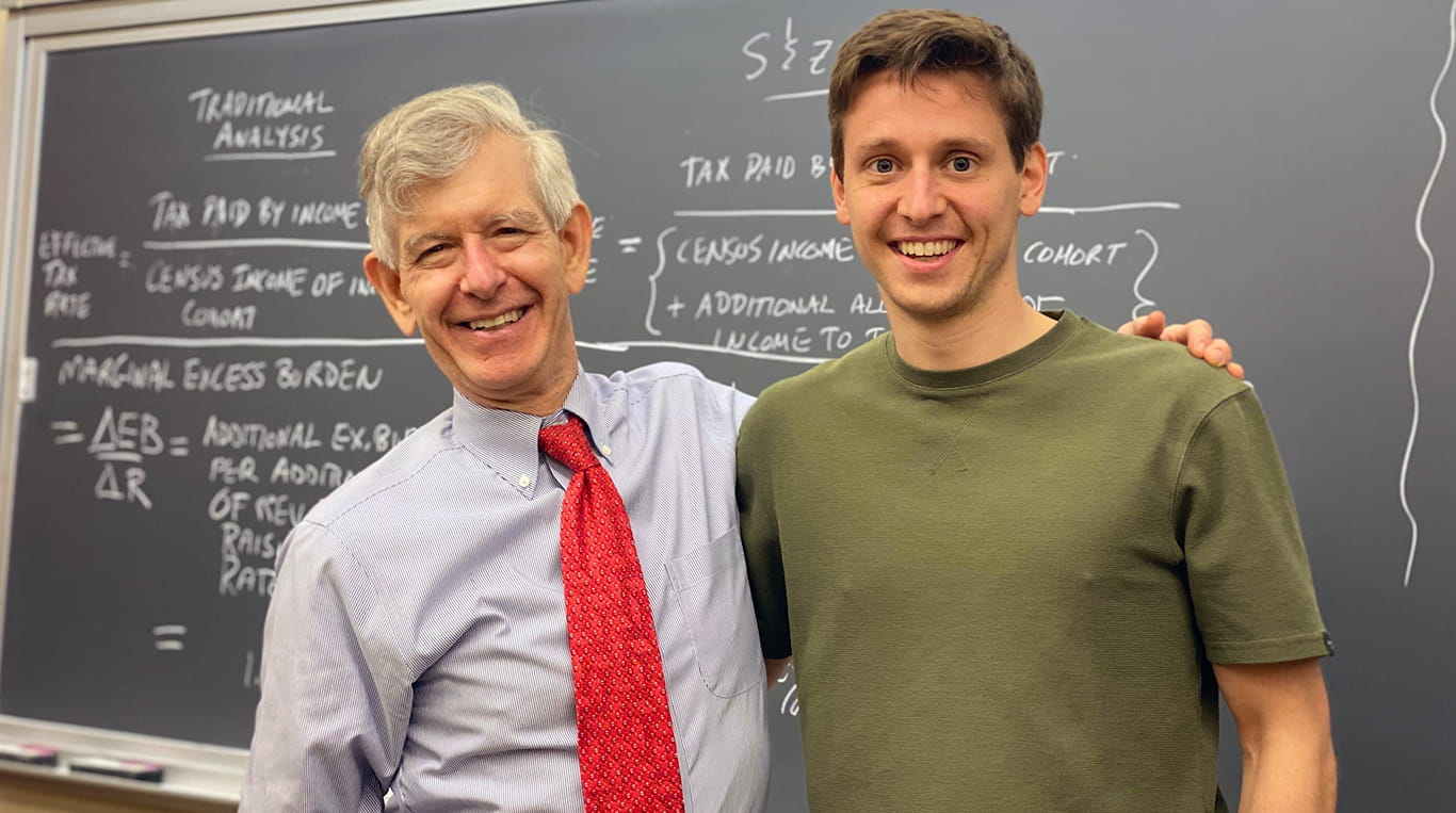 Bjorn de Groote ’23 MBA Kellogg graduate with one of his favorite professors David Besanko