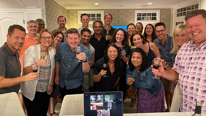 A group of friends raise their classes in a toast, at a reunion 20 years after the trip to China where they met