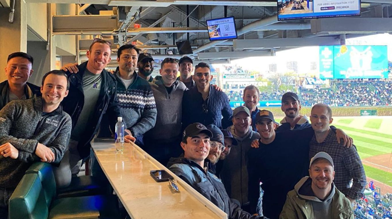 Jimmy England, a Two-Year MBA student at Kellogg, along with other members of the Kellogg Veterans Association at a baseball game 