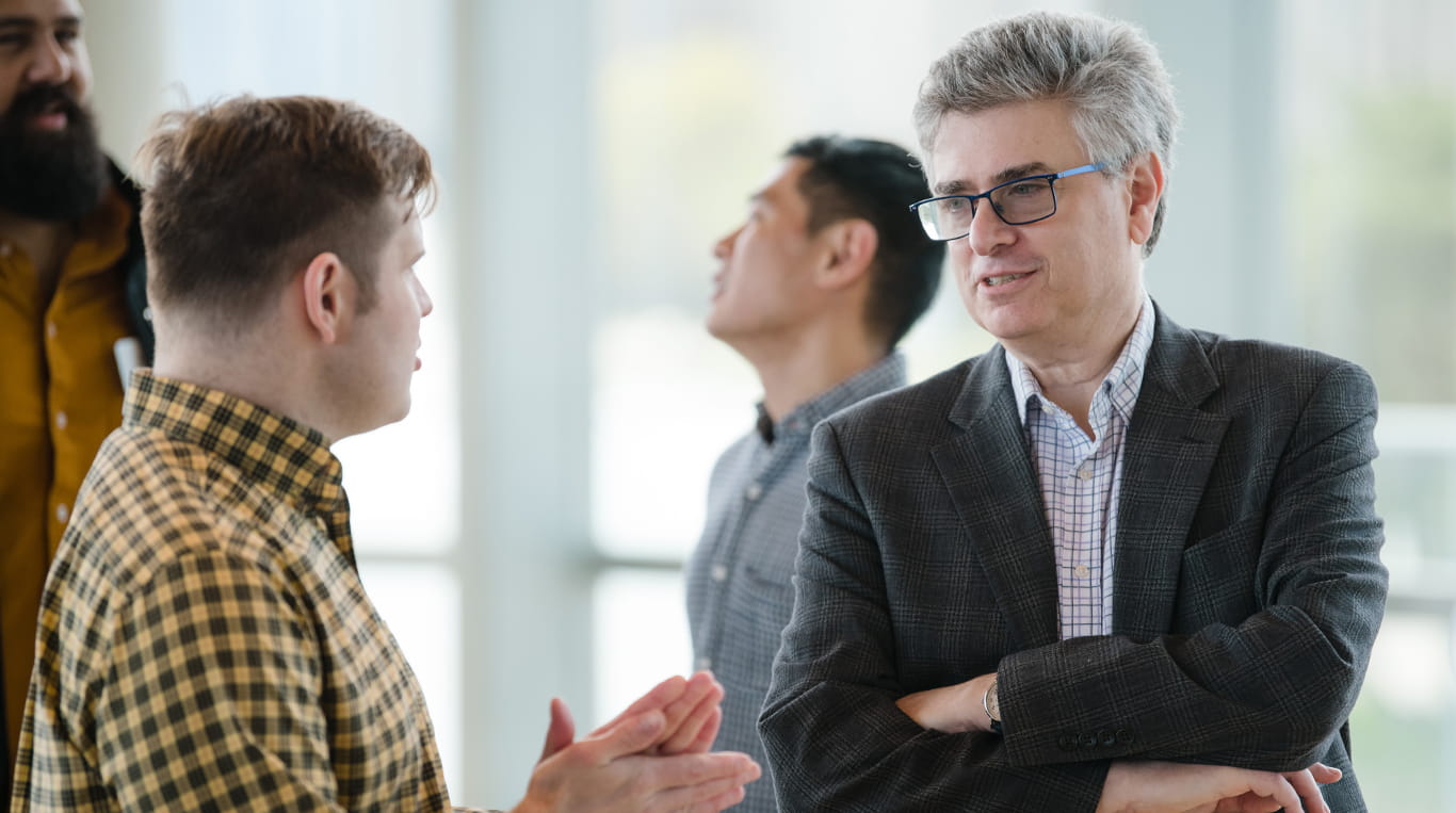 Faculty member Andrew Fano speaking with a student from the MBAi Program at Kellogg.