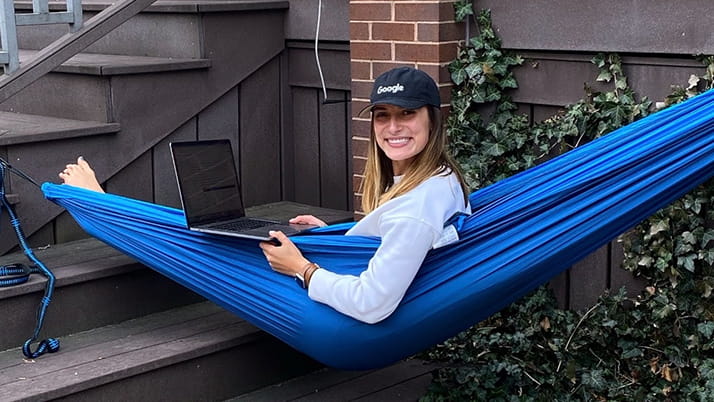 Swinging in her hammock, Izzy, an MBA student at Kellogg, finds ways to create joy during her day to help balance out her academic responsibilities.